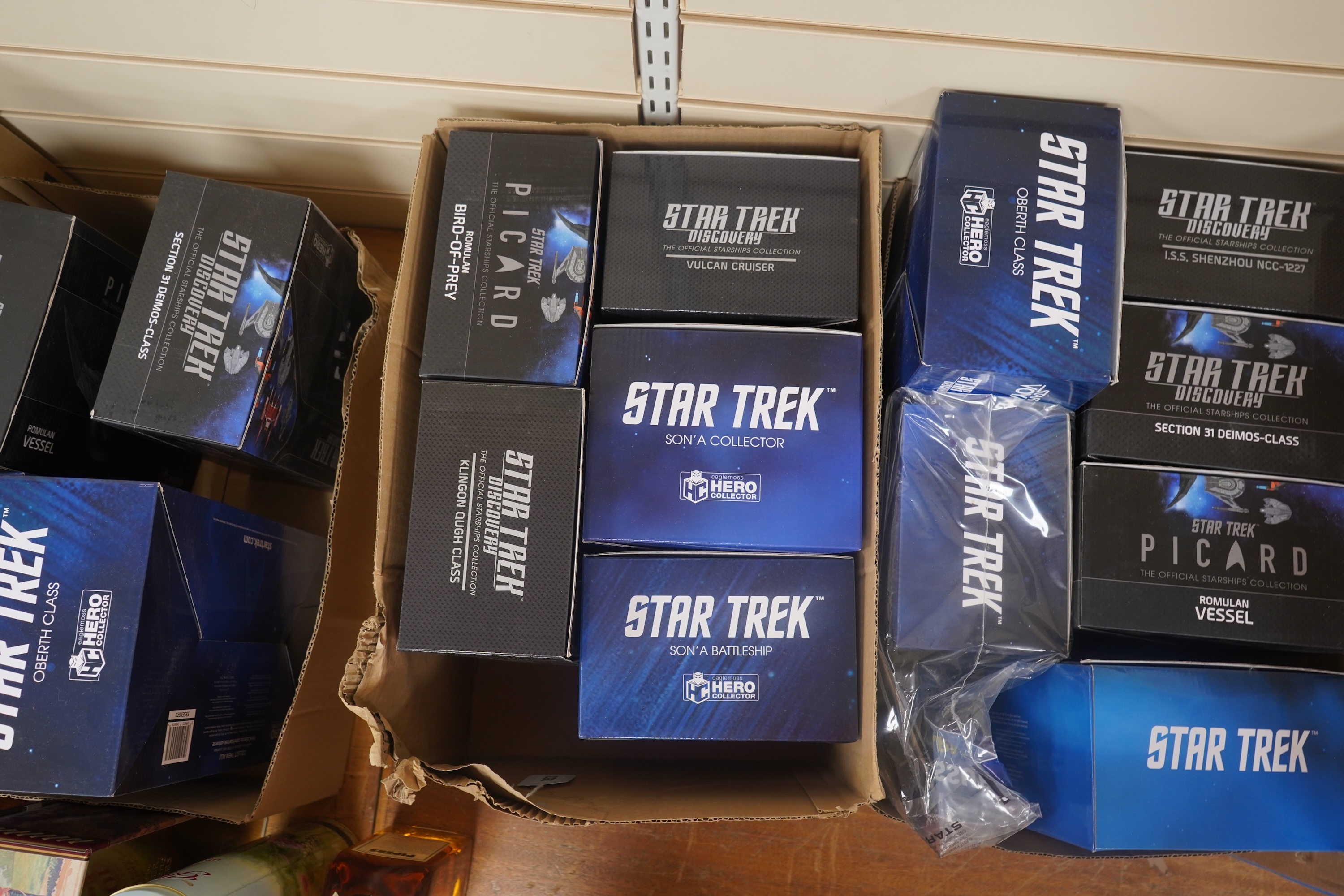 Nineteen boxed Eaglemoss Star Trek magazine issue models, including; a Vulcan Cruiser, a Klingon Qugh Class vessel, a Son’a Battleship, a Romulan Flagship, Jupiter Station, Ty’Gokor Orbital Station, etc. Condition - good